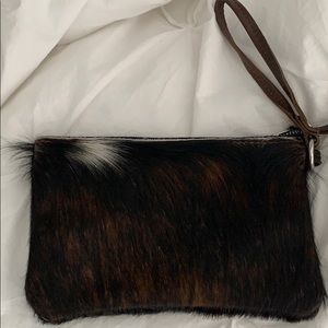 Animal hide clutch.